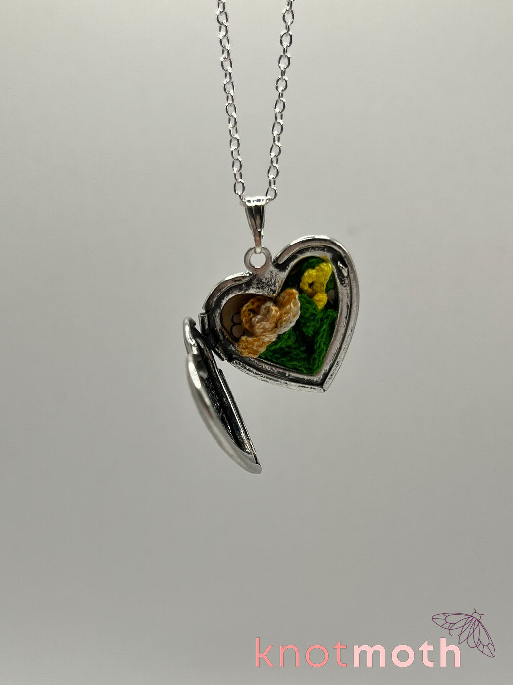 Iris (passion, joy) floriography micro-crochet locket