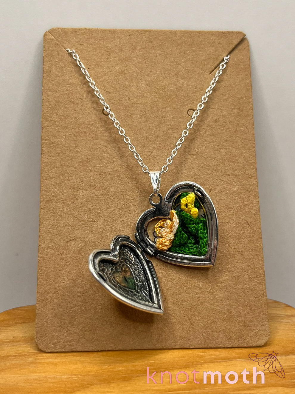 Iris (passion, joy) floriography micro-crochet locket