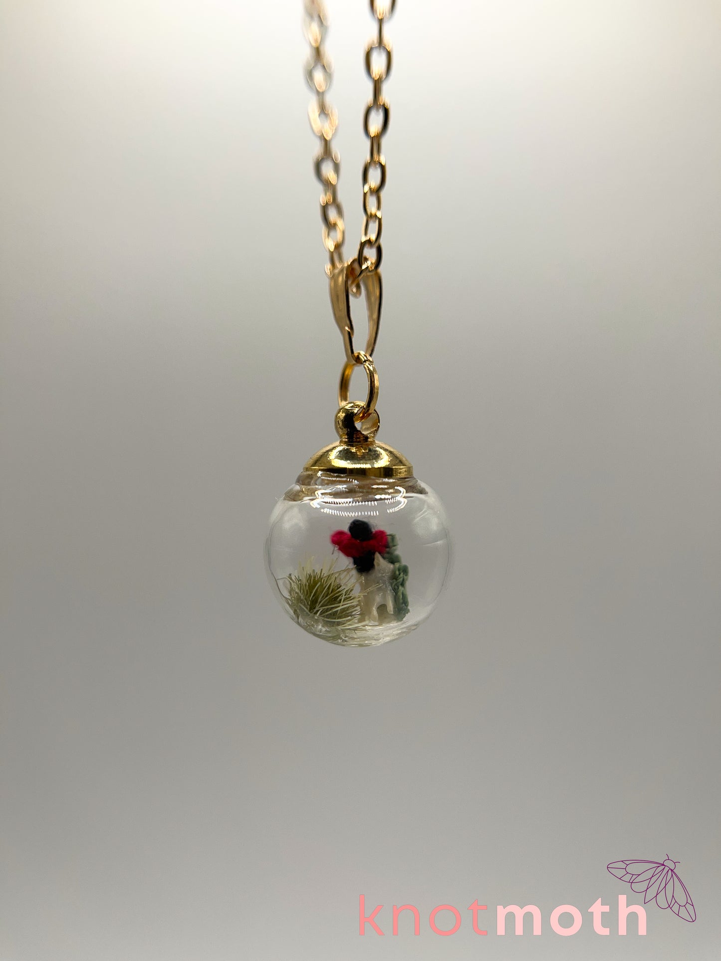poppy flower & vertebra bone micro crochet mini globe necklace