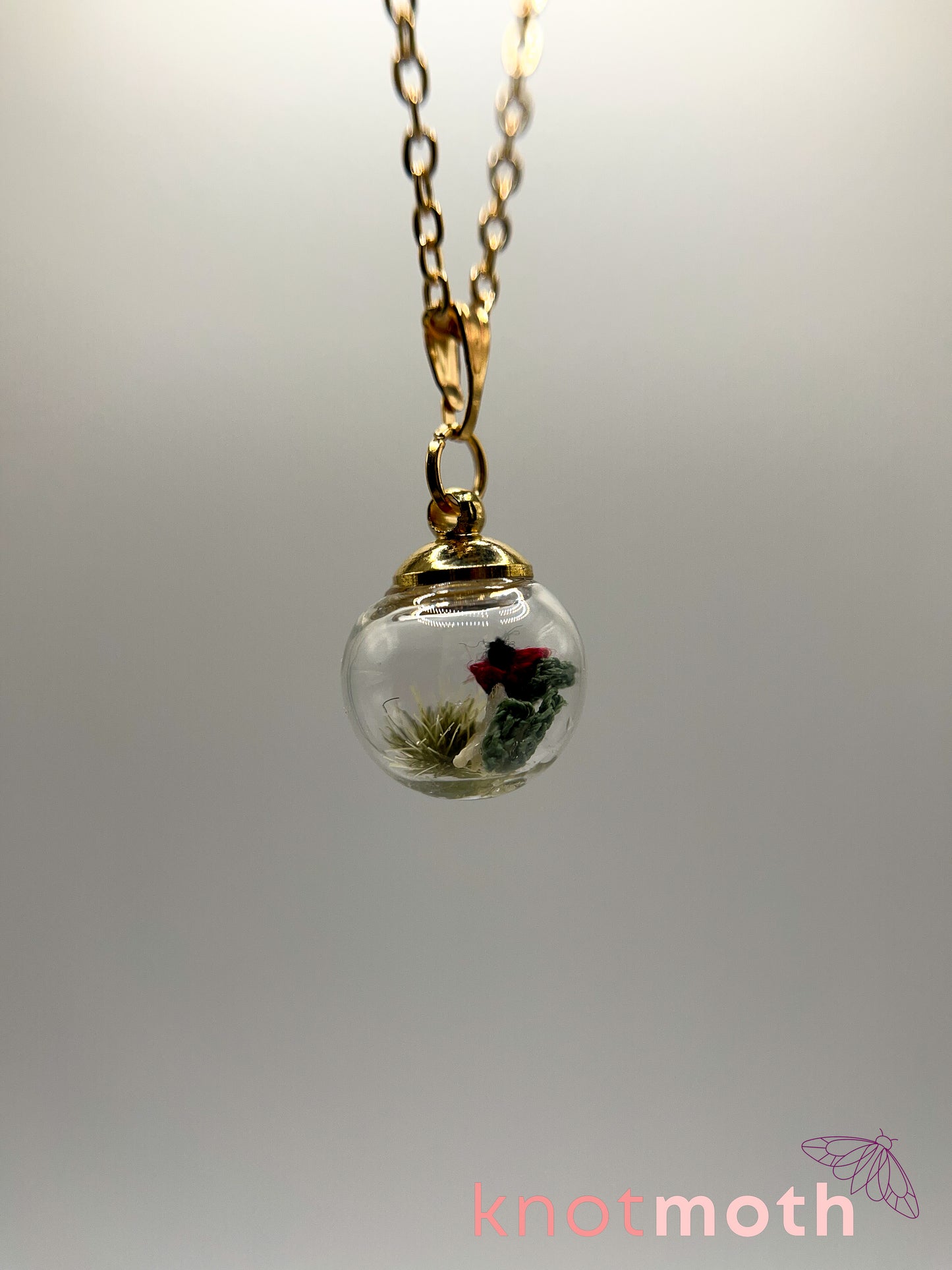 poppy flower & vertebra bone micro crochet mini globe necklace