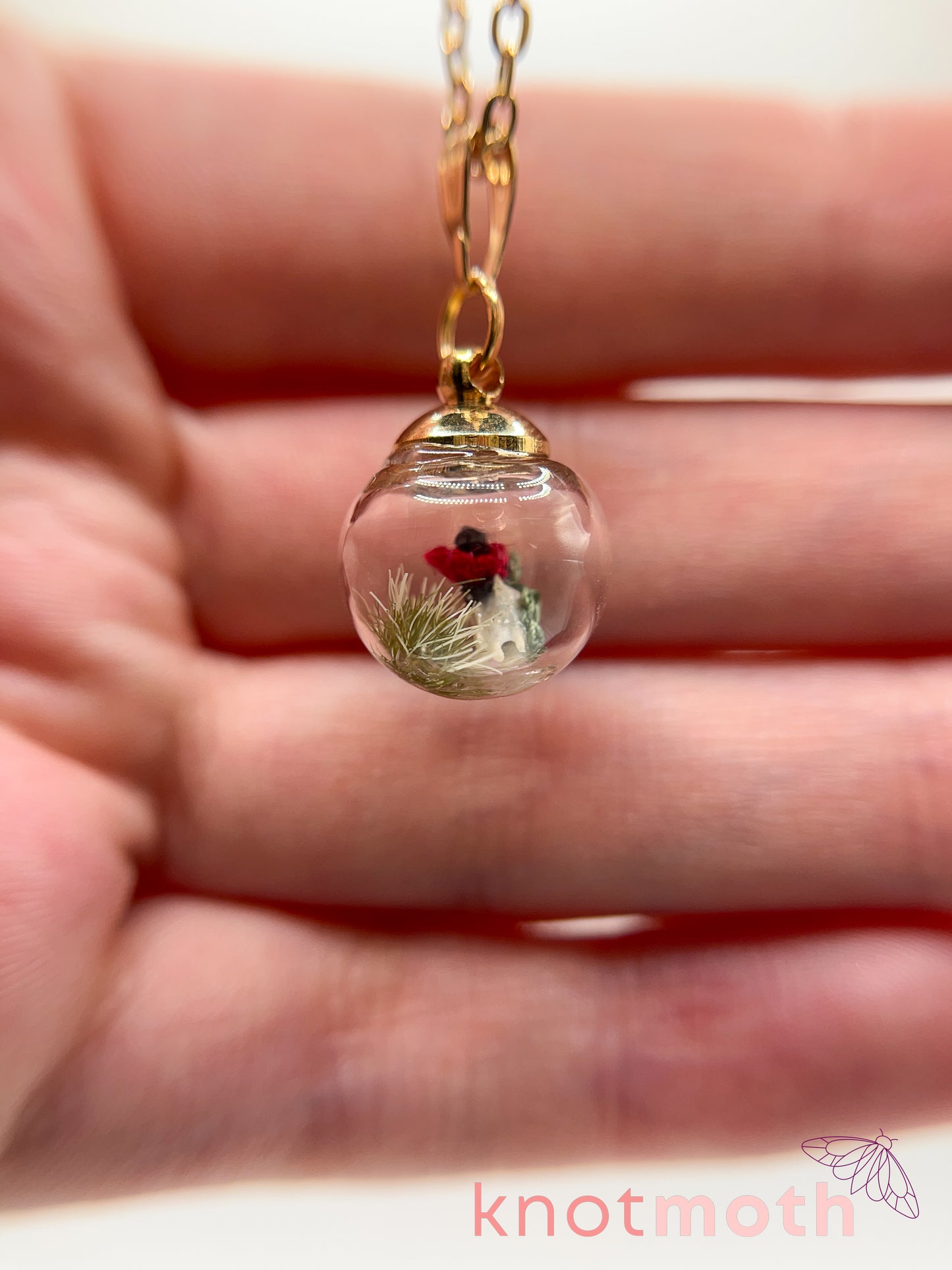 poppy flower & vertebra bone micro crochet mini globe necklace