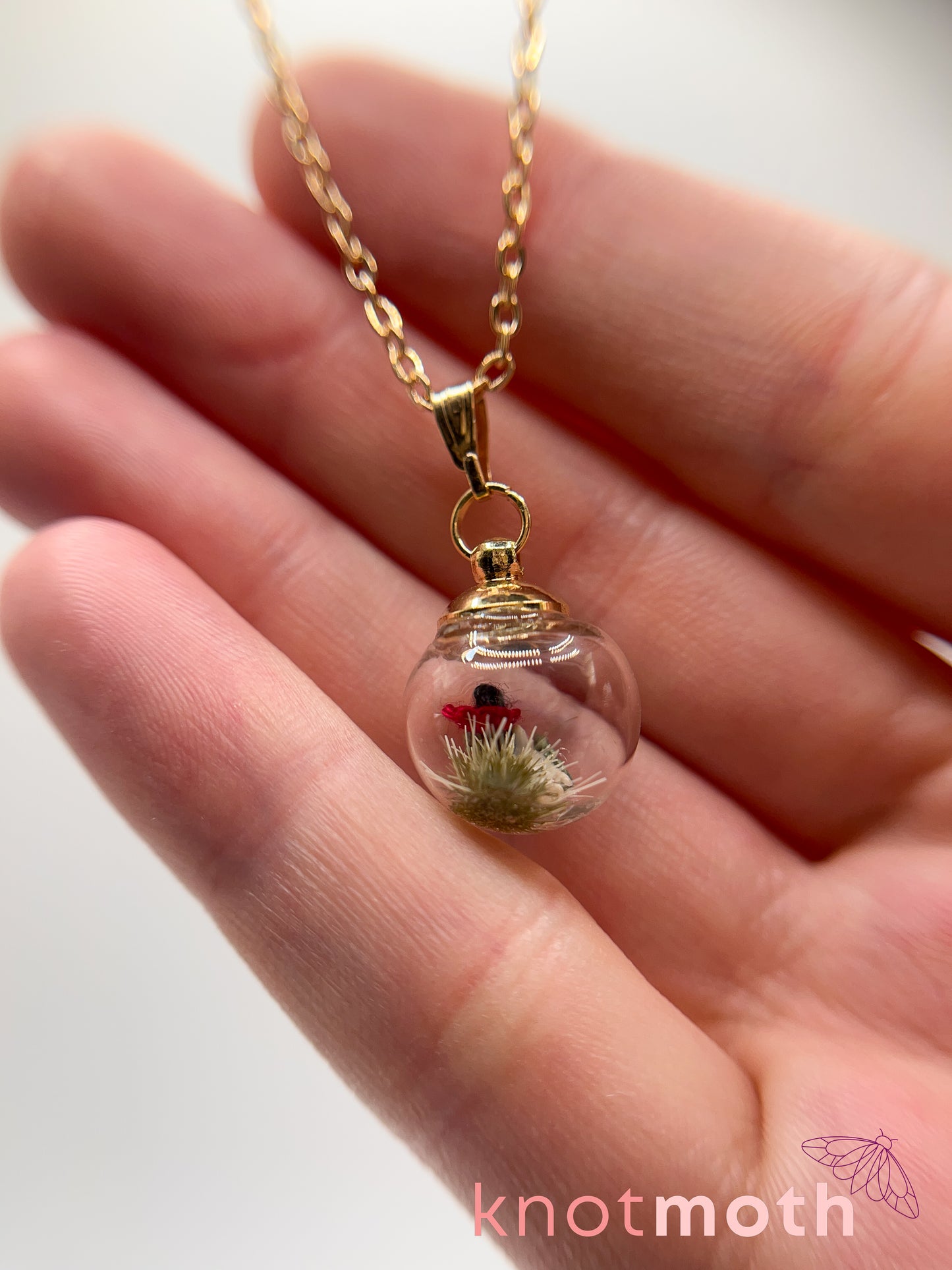 poppy flower & vertebra bone micro crochet mini globe necklace