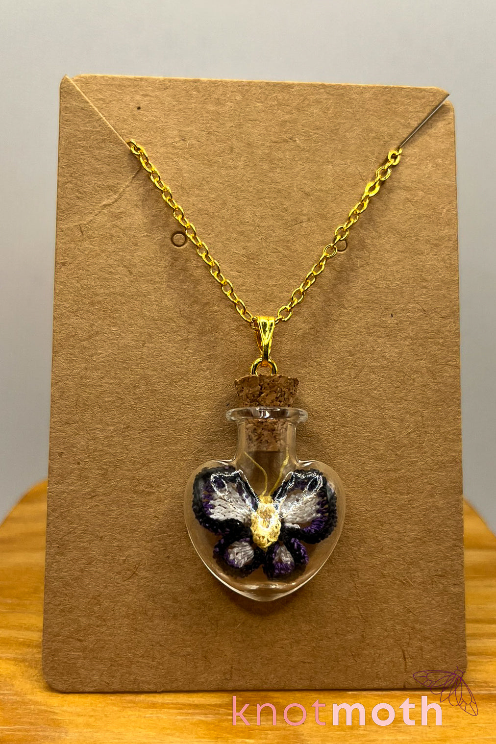 poe butterfly trinket jar necklace