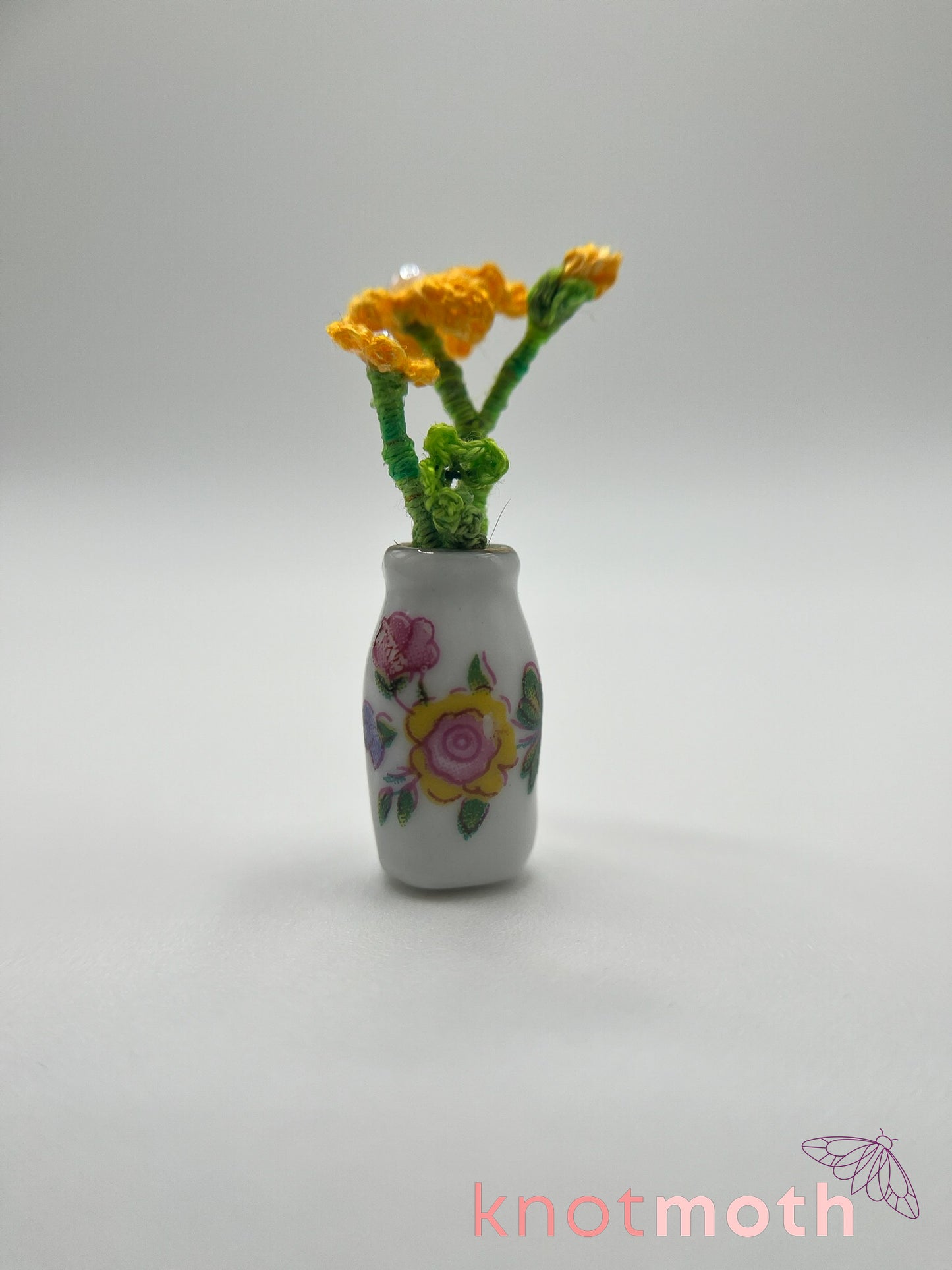 micro crochet flower arrangement in ceramic vase