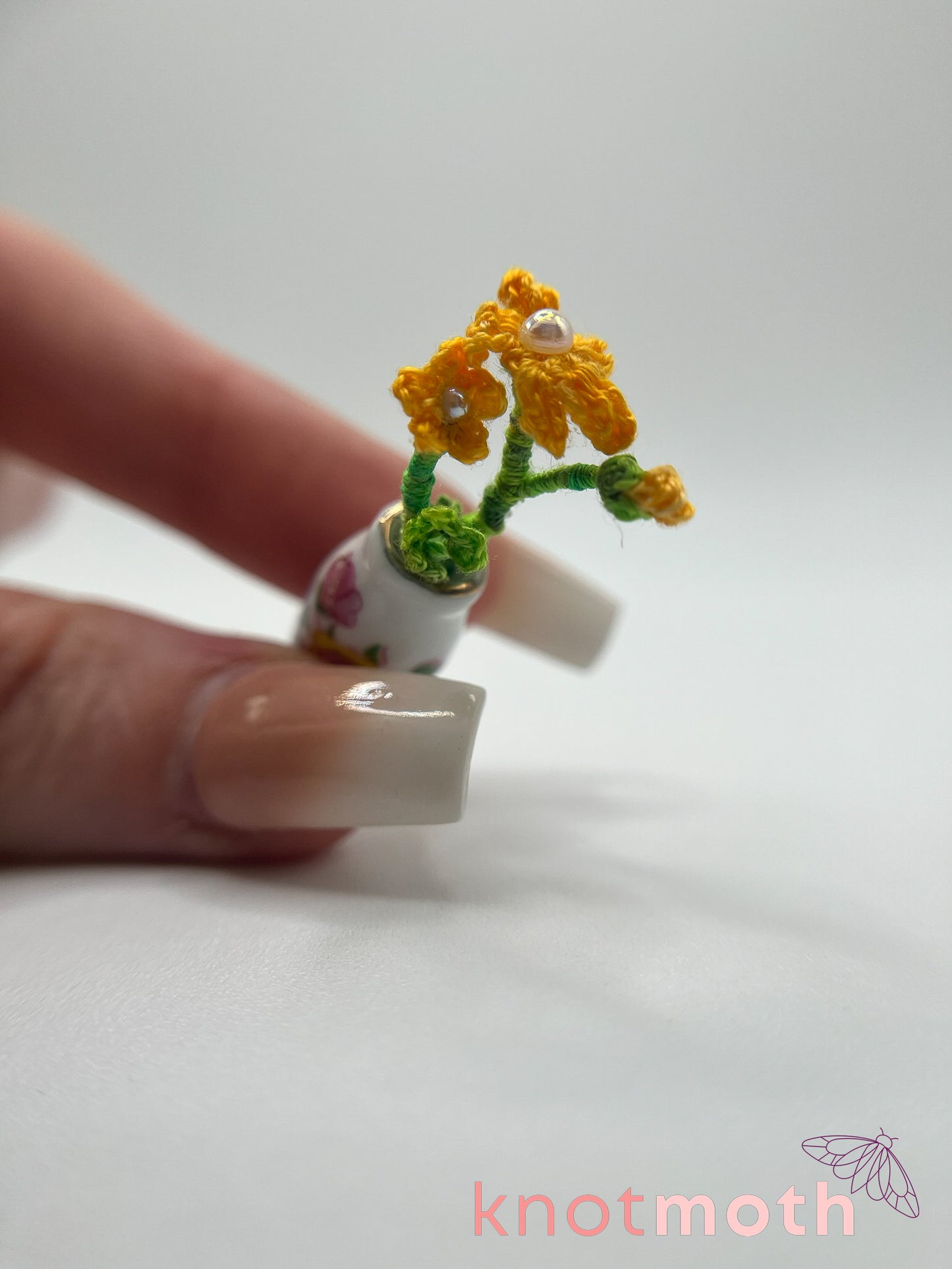 micro crochet flower arrangement in ceramic vase