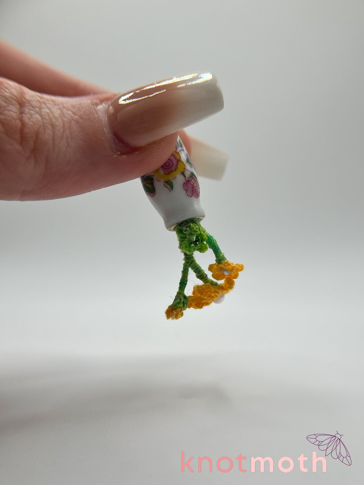 micro crochet flower arrangement in ceramic vase