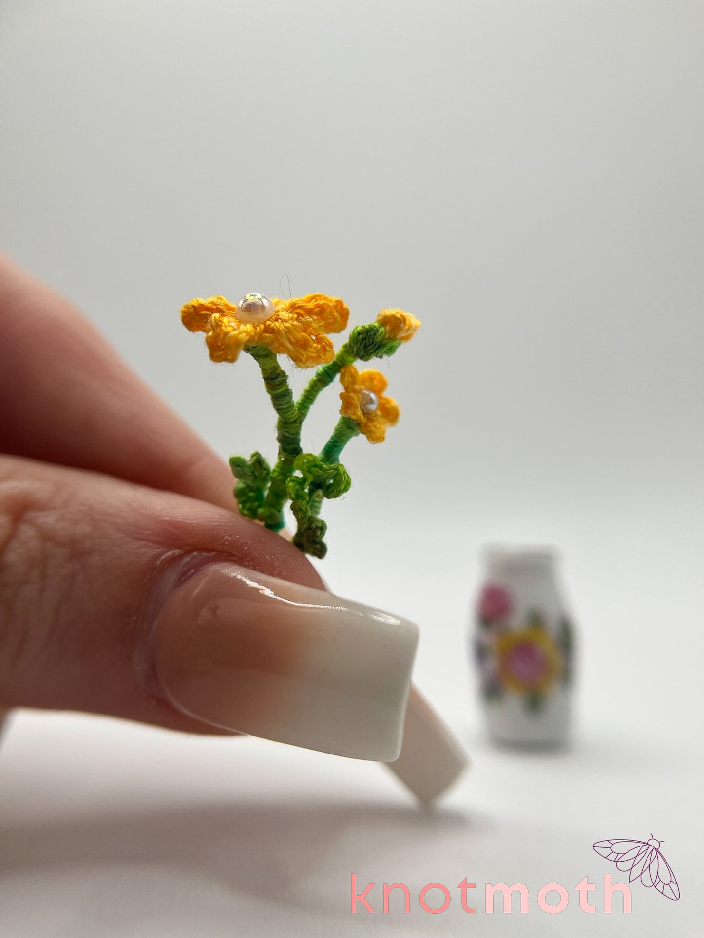micro crochet flower arrangement in ceramic vase