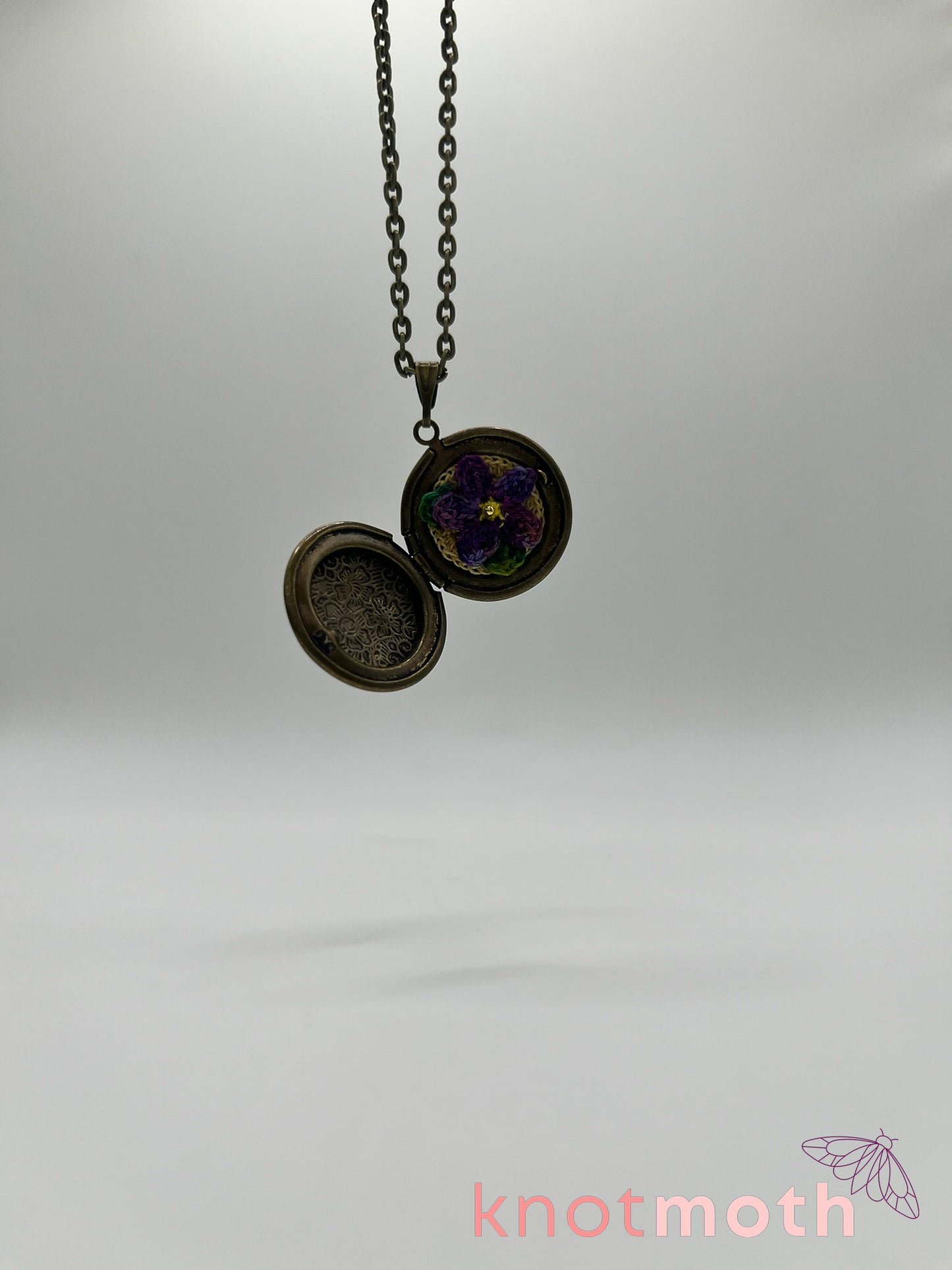 violet floriography micro-crochet locket