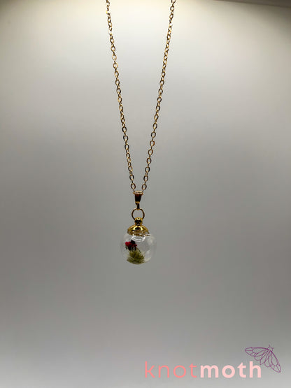 poppy flower & vertebra bone micro crochet mini globe necklace