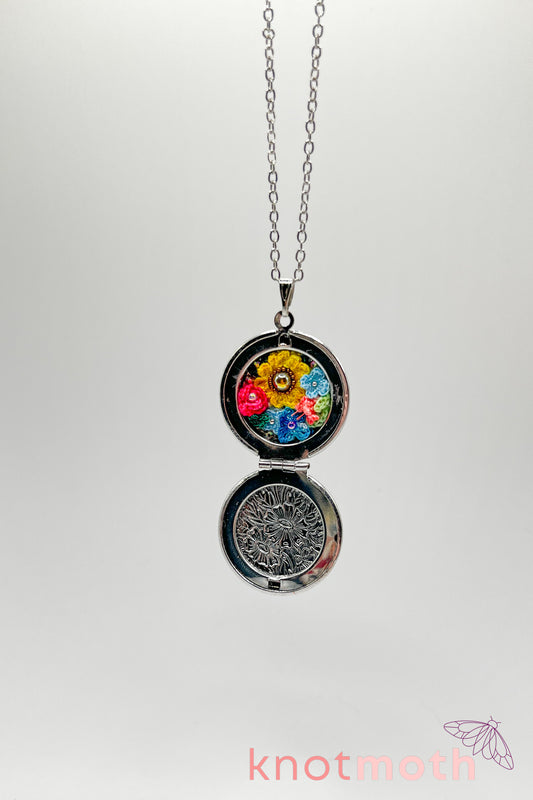 Rose, lily, daisy, and sunflower (love, loyalty, & gratitude) floriography micro-crochet locket