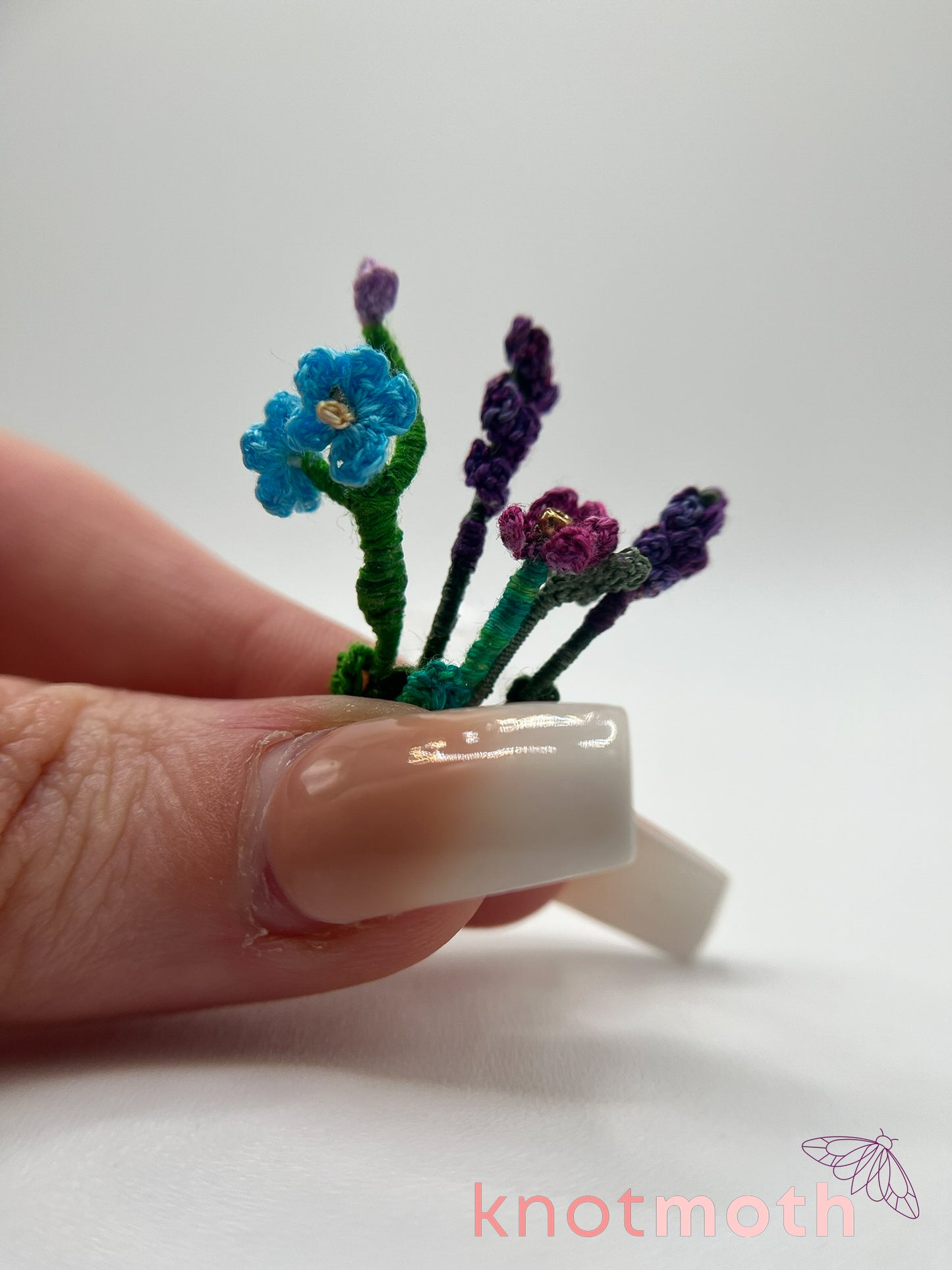 micro crochet flower arrangement in glass vase