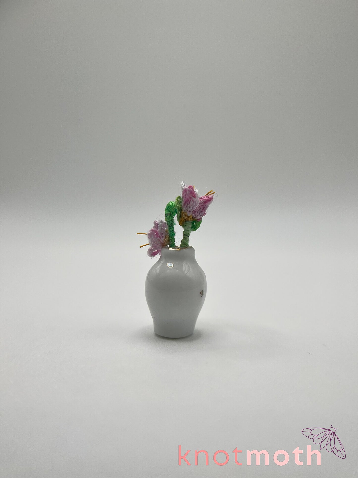 micro crochet flower arrangement in ceramic vase