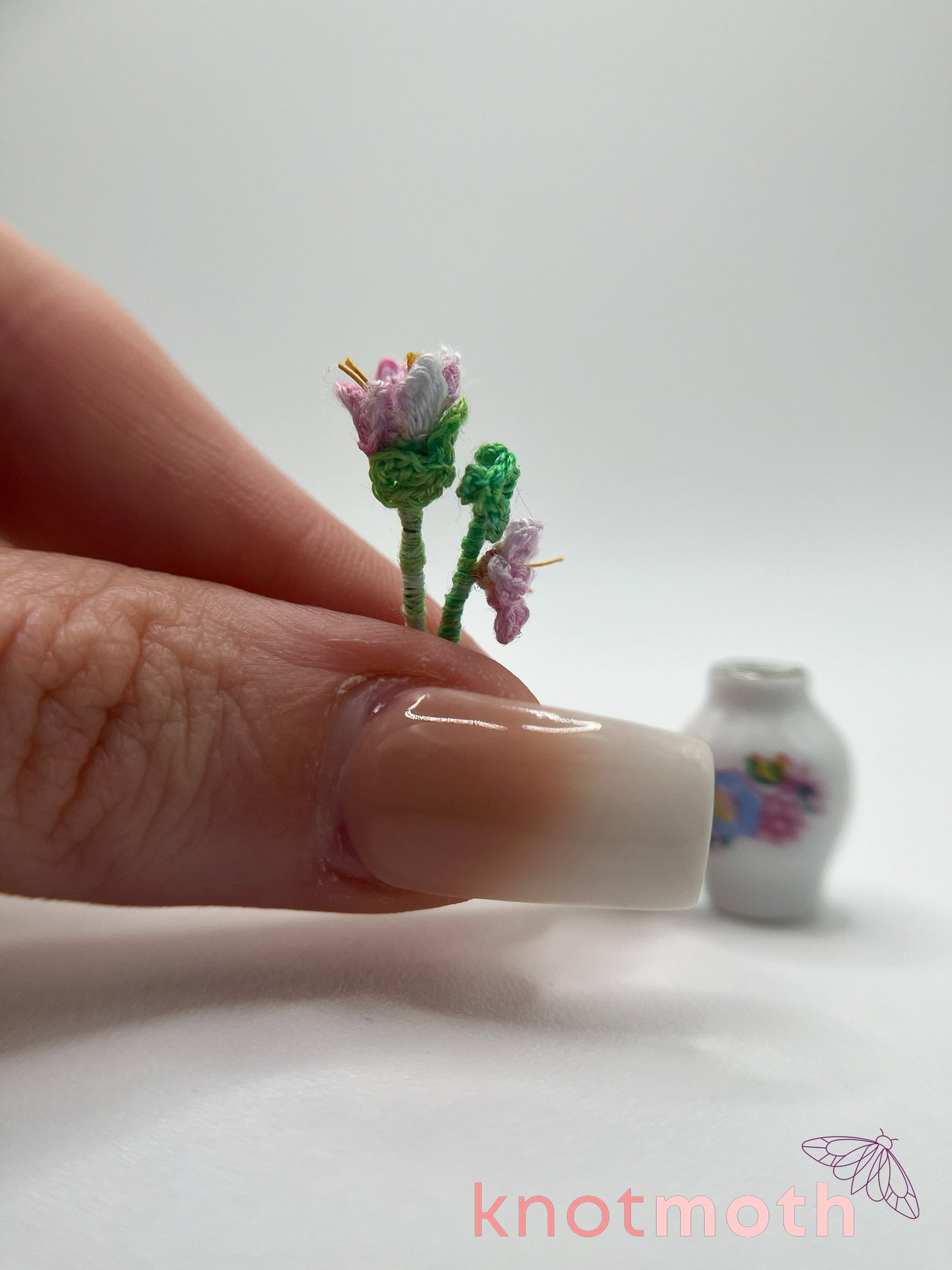 micro crochet flower arrangement in ceramic vase