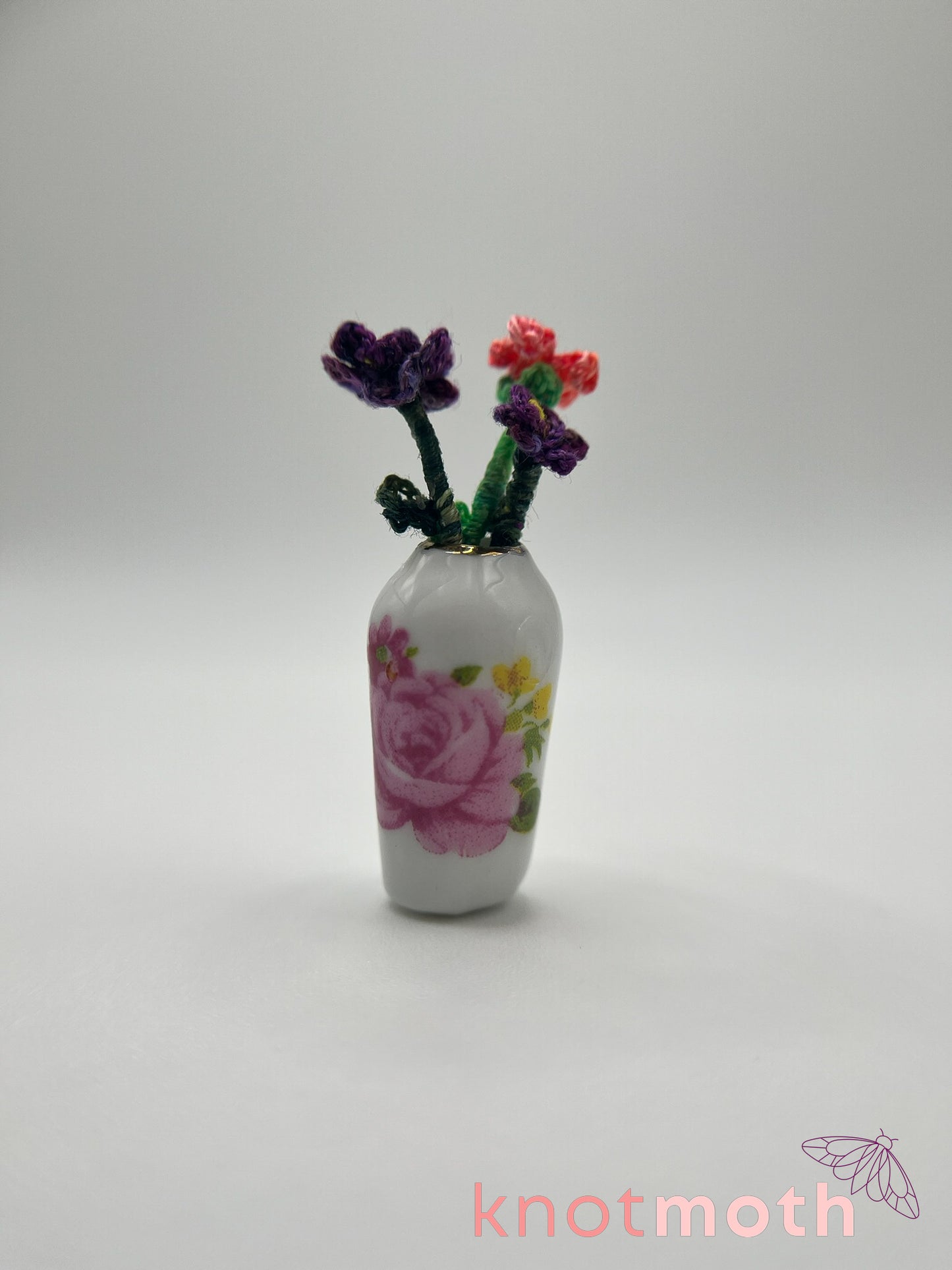 micro crochet flower arrangement in ceramic vase