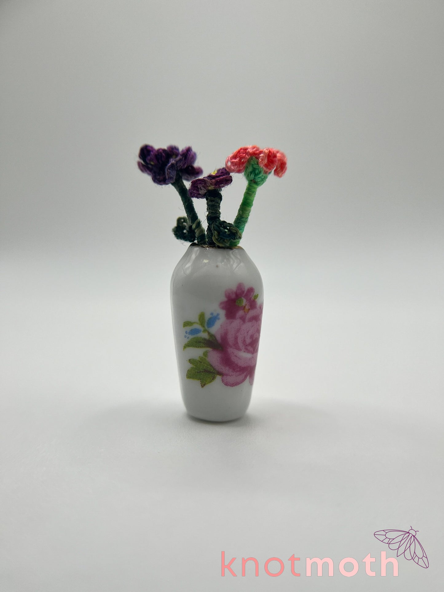 micro crochet flower arrangement in ceramic vase