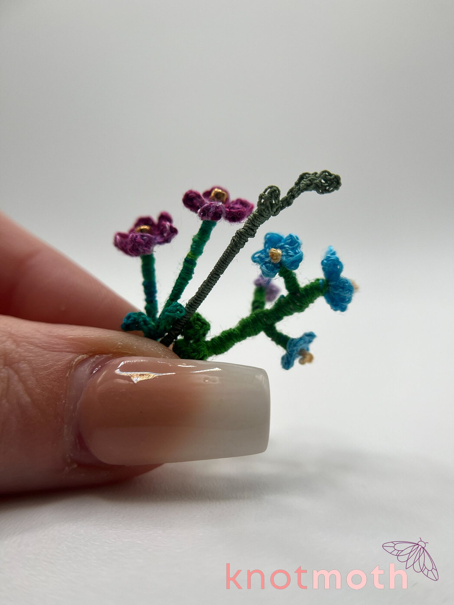 micro crochet flower arrangement in glass vase