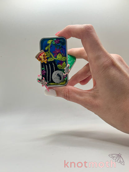 trash possums with pizza mini tin