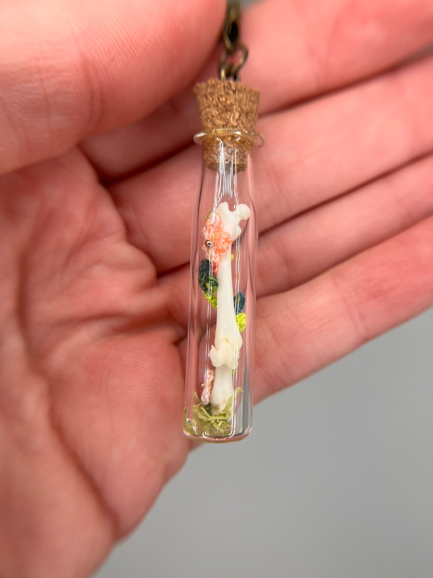 flowers, vine, & paired femora - bone garden vial necklace