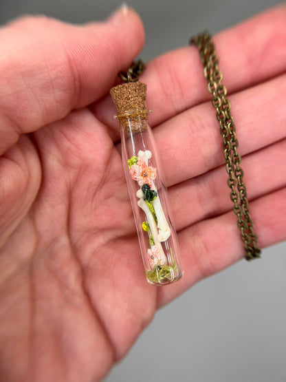 flowers, vine, & paired femora - bone garden vial necklace