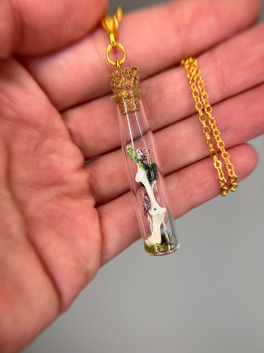 flowers, vine, & paired humeri - bone garden vial necklace