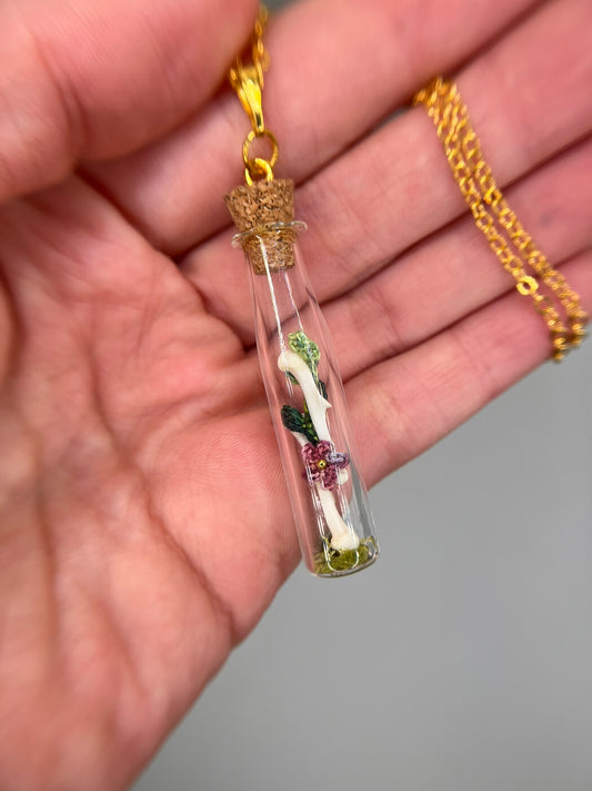 flowers, vine, & paired humeri - bone garden vial necklace